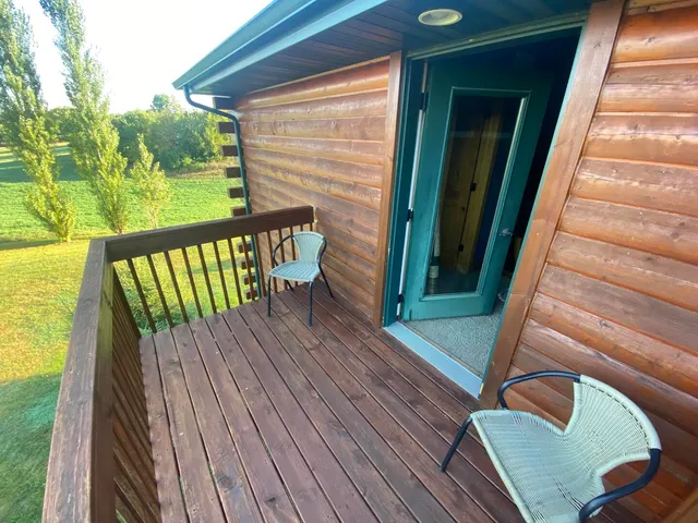 a view of a balcony with wooden floor