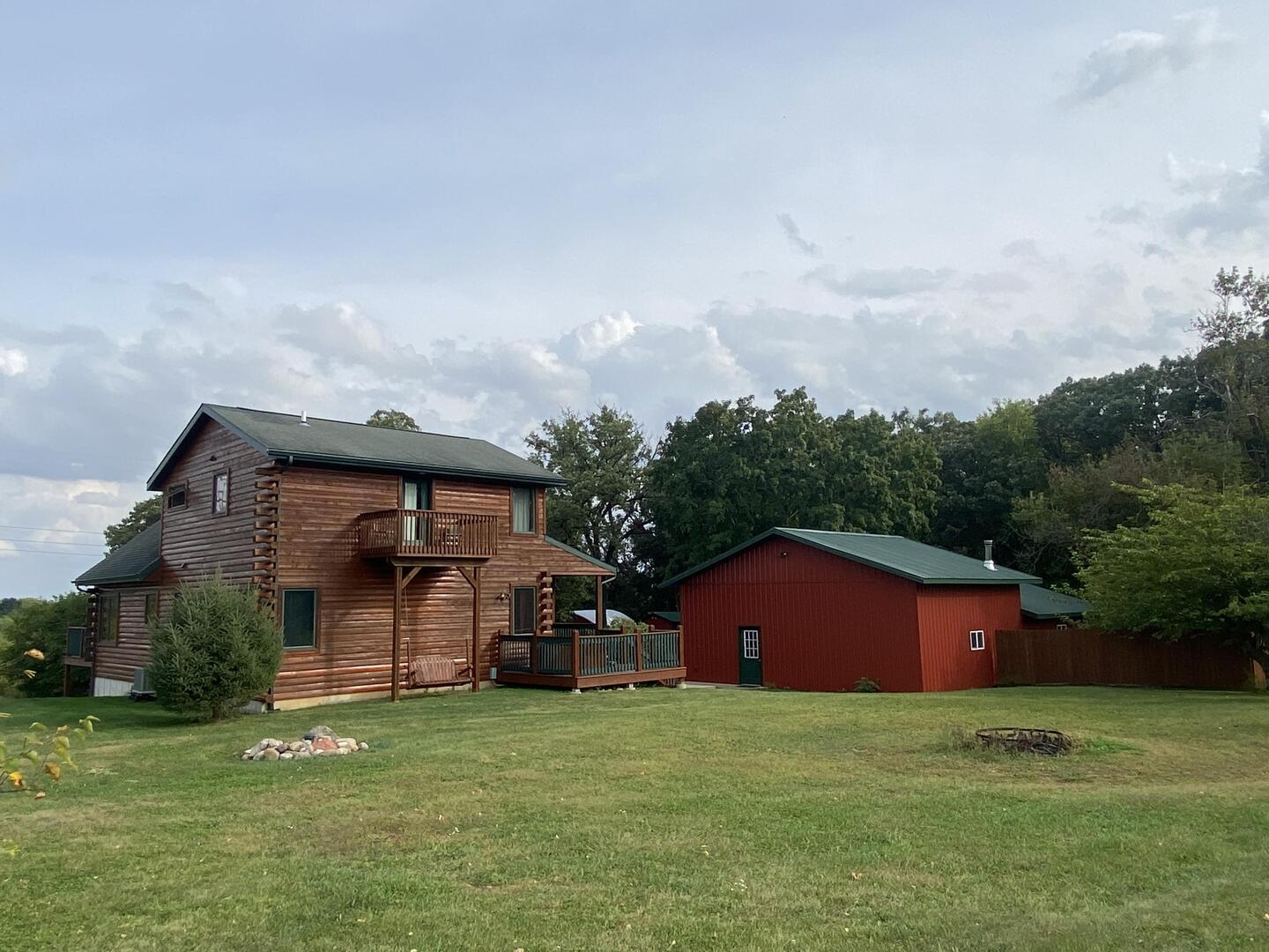 7330 North Crestview Road Stillman Valley, IL 61084 - Photo 2 of 33 a front view of house with yard and trees in the background