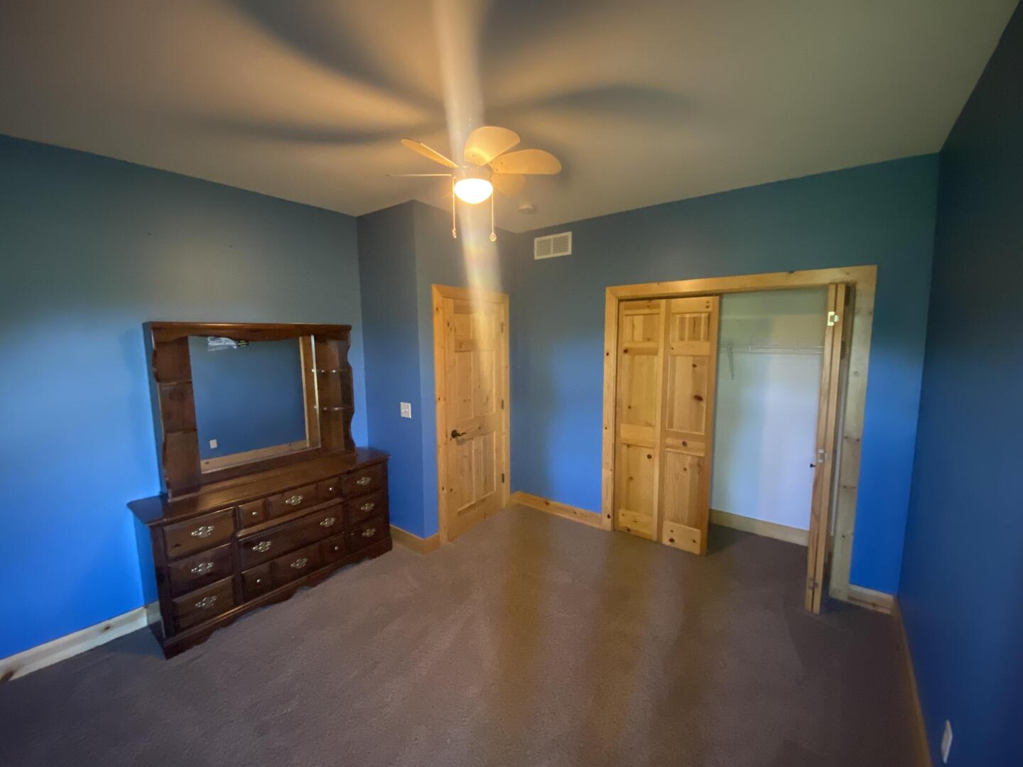7330 North Crestview Road Stillman Valley, IL 61084 - Photo 21 of 33 a view of an empty room with closet and wooden floor