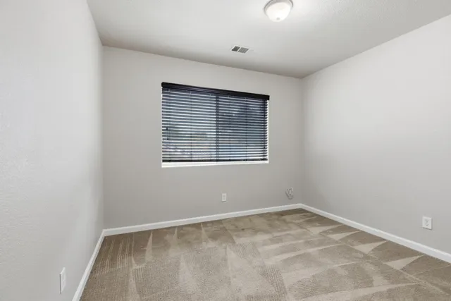 a bathroom with a sink double vanity and a mirror