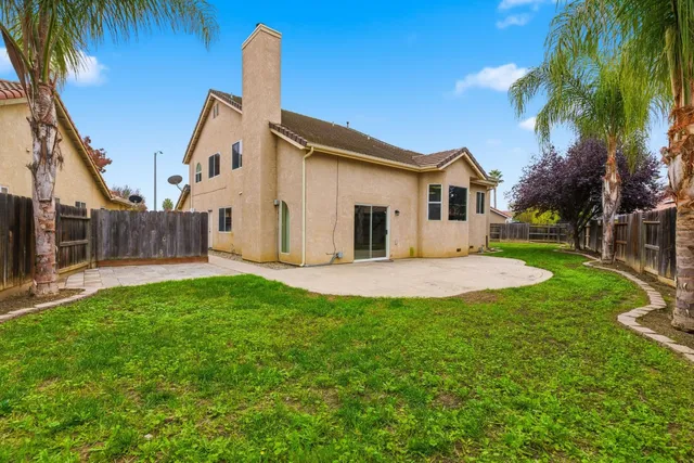 a house with palm tree in front of it