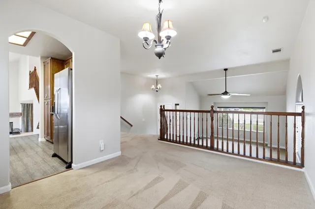 a view of a hallway with a chandelier