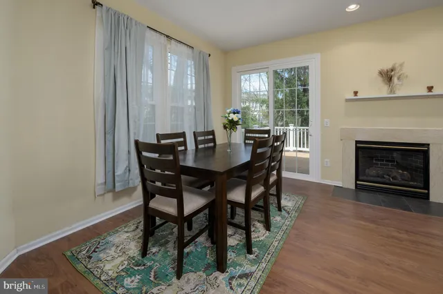 a bathroom with a tub sink and window