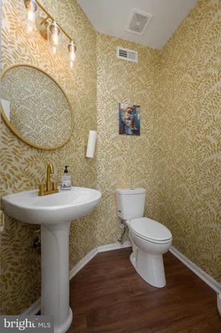 a view of a deck with furniture and a garden