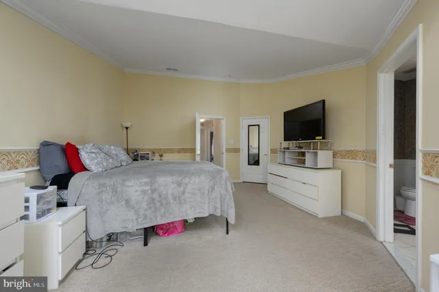 an aerial view of a house with a yard and lake view