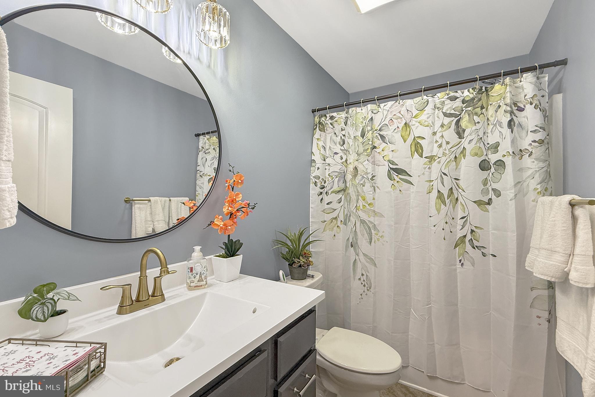 87 Trapper Lane Magnolia, DE 19962 - Photo 28 of 39 a bathroom with a sink vanity mirror and toilet