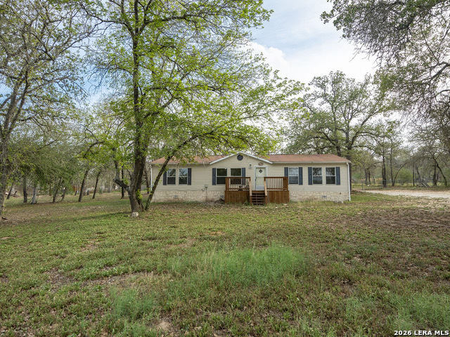 135 Savannah Ridge Von Ormy, TX 78073 - Photo 7 of 45 a front view of a house with a yard
