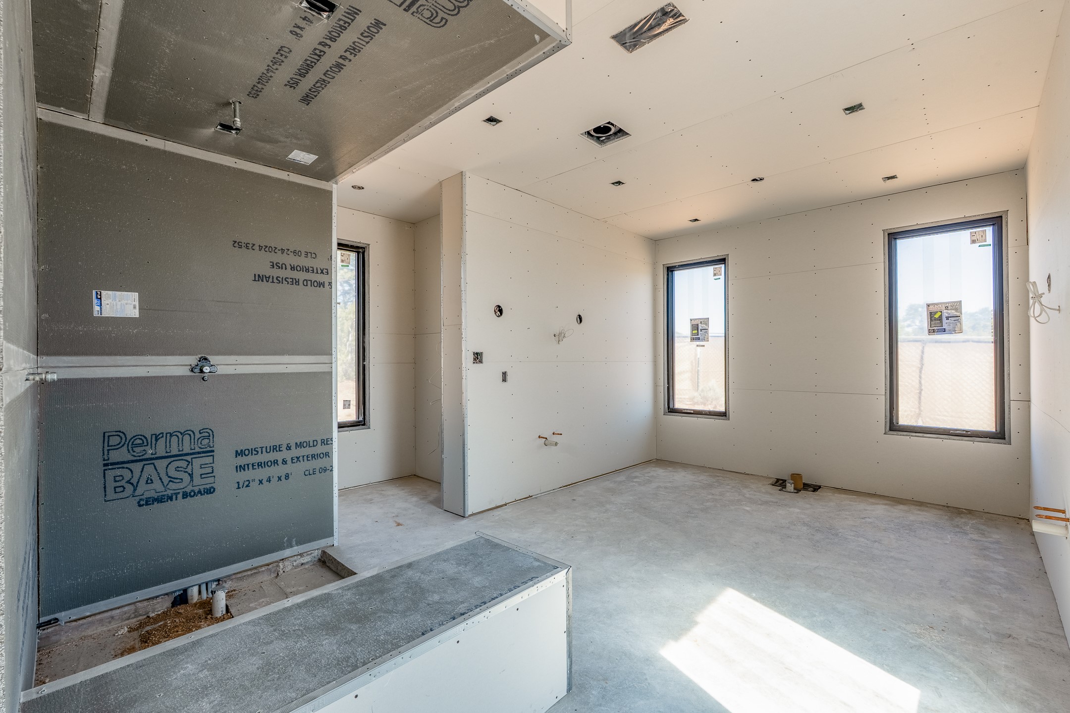 26 Sierra Rosa Loop Santa Fe, NM 87506 - Photo 20 of 25 Primary bath with steam shower, vessel tub and double vanities.