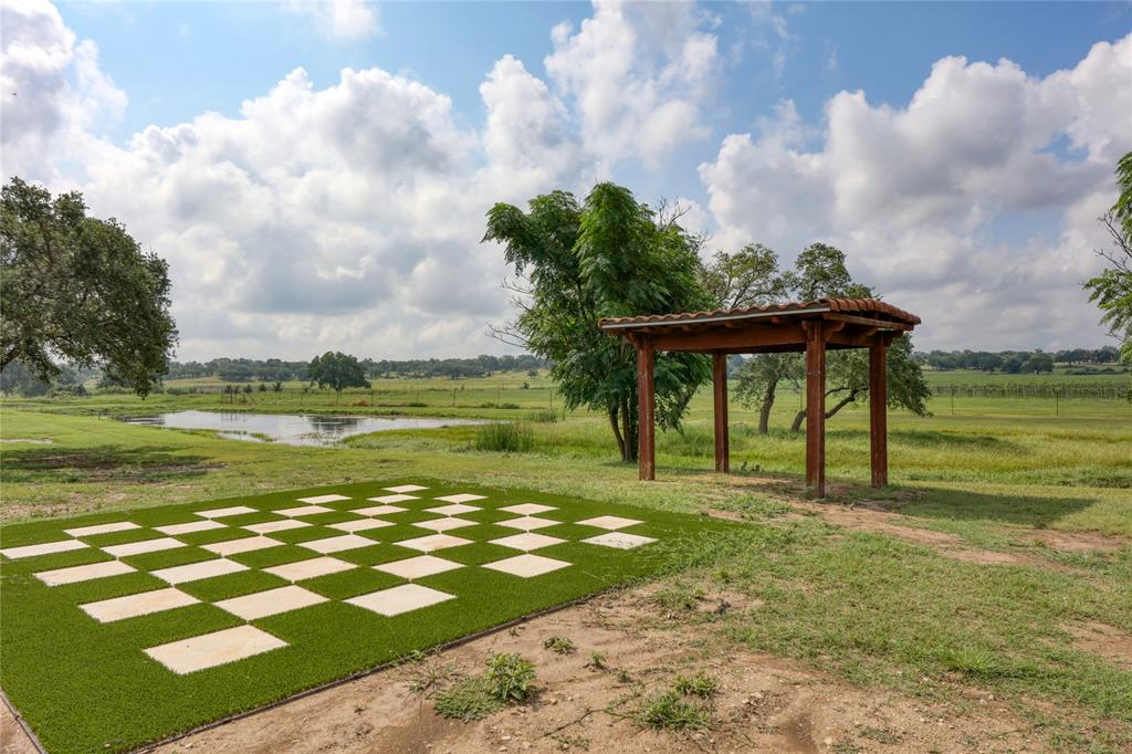115 Strada Luca Florence, TX 76527 - Photo 6 of 25 a view of a lake with a big yard