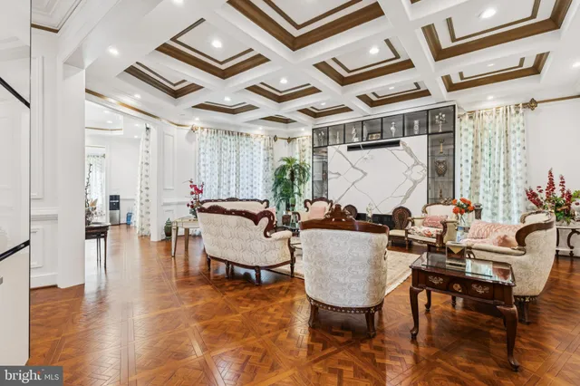 a kitchen with kitchen island white cabinets and stainless steel appliances