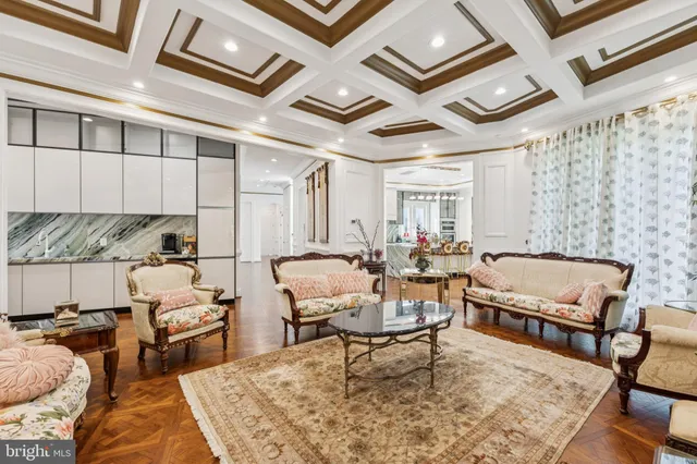 a view of a dining room with furniture and chandelier