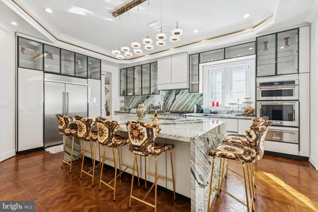 a dining room with furniture a chandelier and window
