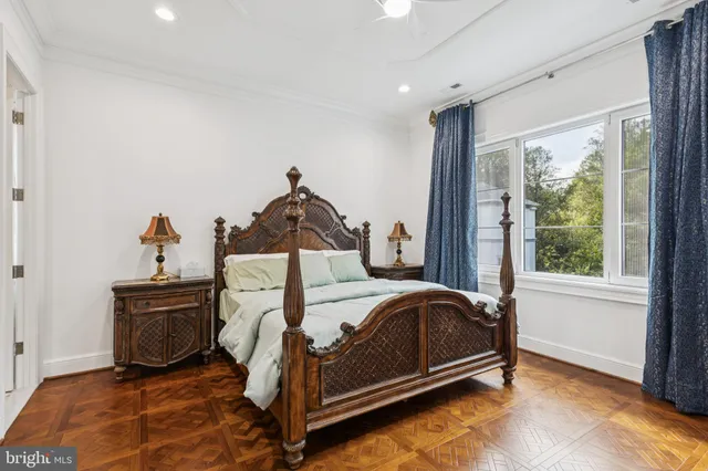 a bed room with a bed and a chair