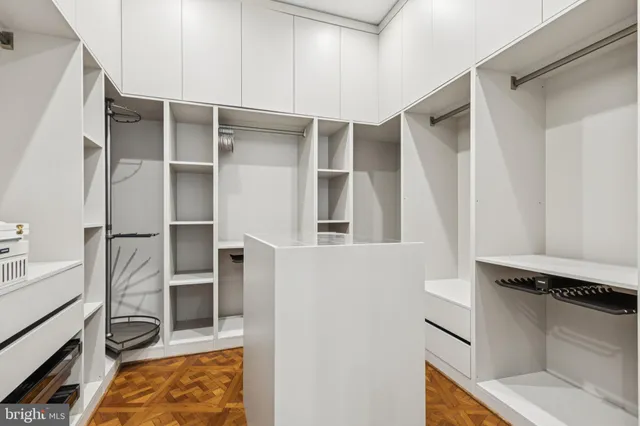 a spacious bathroom with a tub sink and window