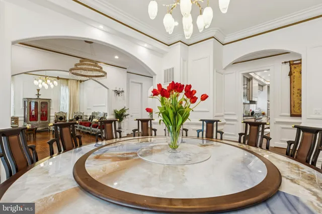 a dining room with furniture and window