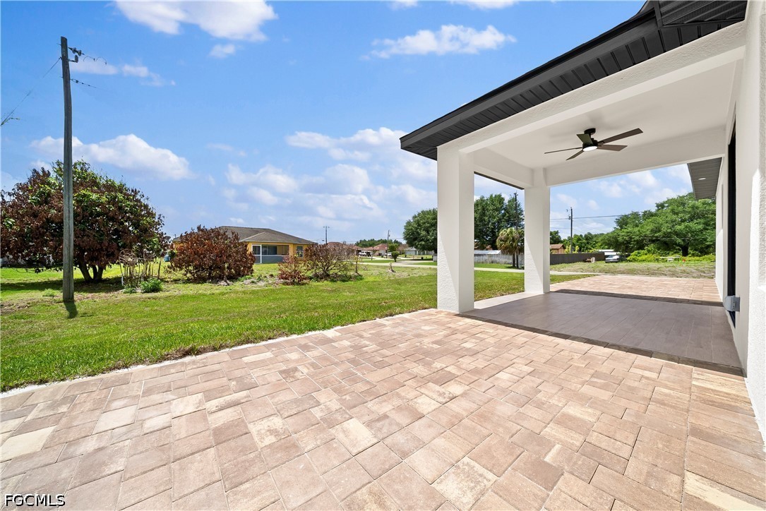 2919 9th Street Southwest Lehigh Acres, FL 33976 - Photo 18 of 29 a view of a house with a big yard and potted plants