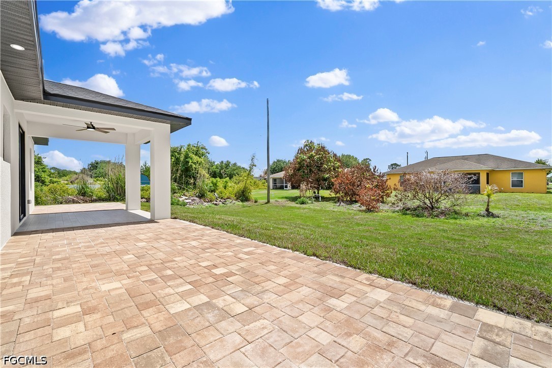 2919 9th Street Southwest Lehigh Acres, FL 33976 - Photo 19 of 29 a view of a house with a yard