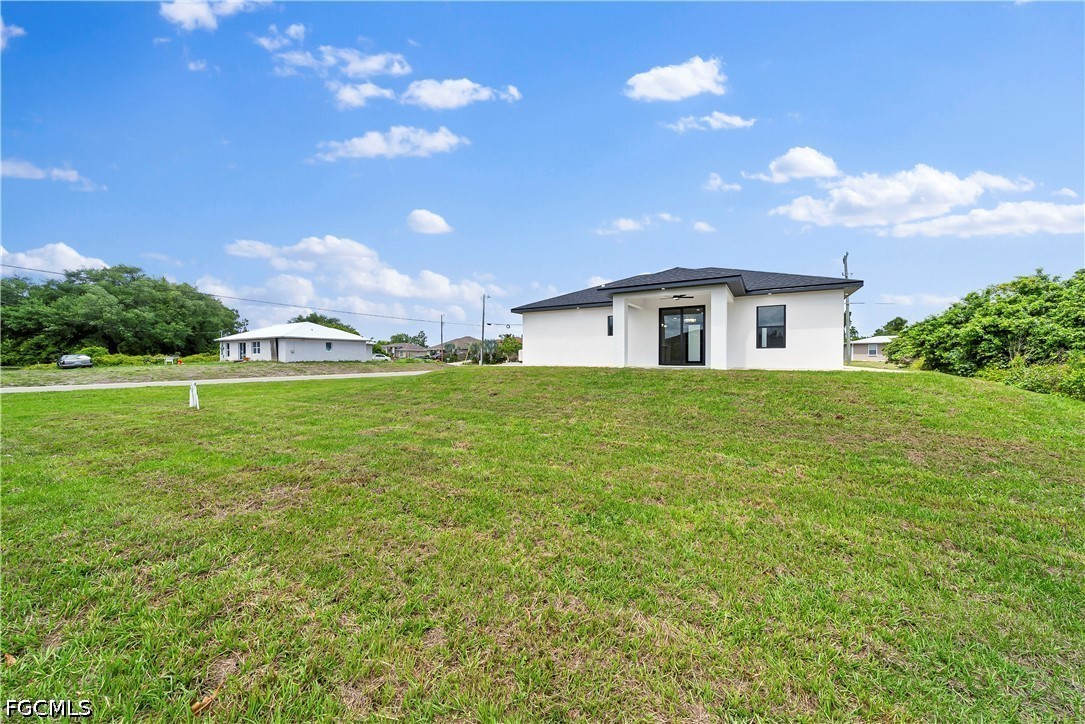 2919 9th Street Southwest Lehigh Acres, FL 33976 - Photo 22 of 29 a house view with a garden space