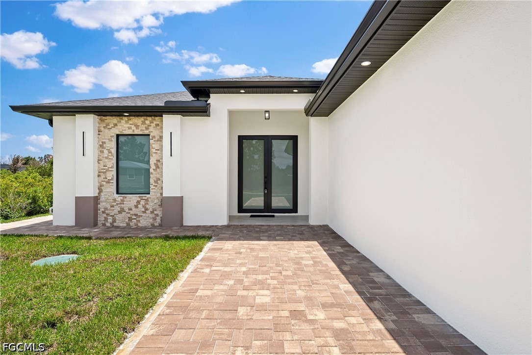 2919 9th Street Southwest Lehigh Acres, FL 33976 - Photo 24 of 29 a front view of a house with a yard