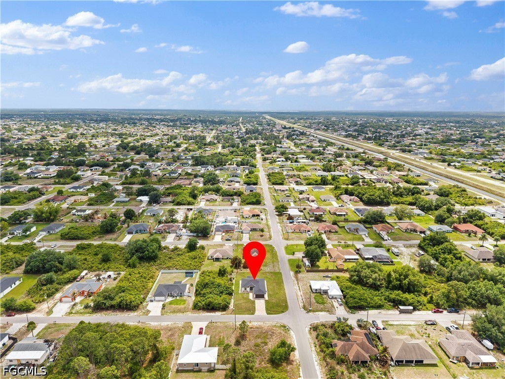 2919 9th Street Southwest Lehigh Acres, FL 33976 - Photo 25 of 29 an aerial view of residential houses with outdoor space