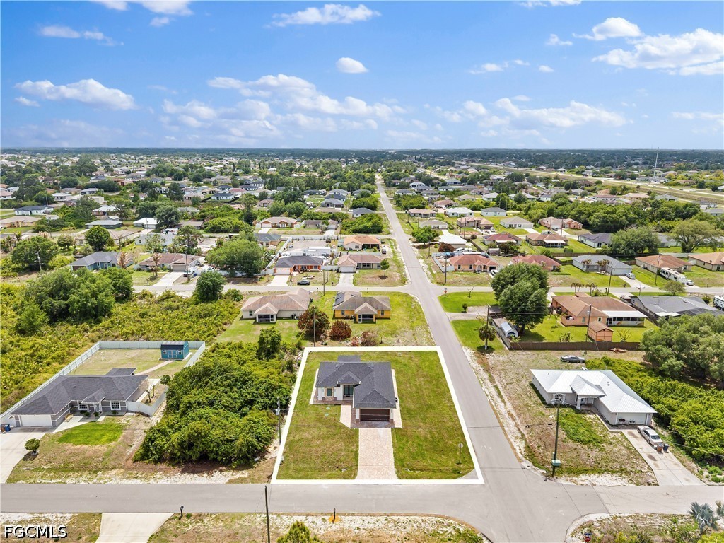 2919 9th Street Southwest Lehigh Acres, FL 33976 - Photo 28 of 29 an aerial view of residential houses with outdoor space