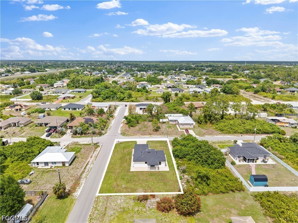 2919 9th Street Southwest Lehigh Acres, FL 33976 - Photo 29 of 29 an aerial view of residential houses with outdoor space