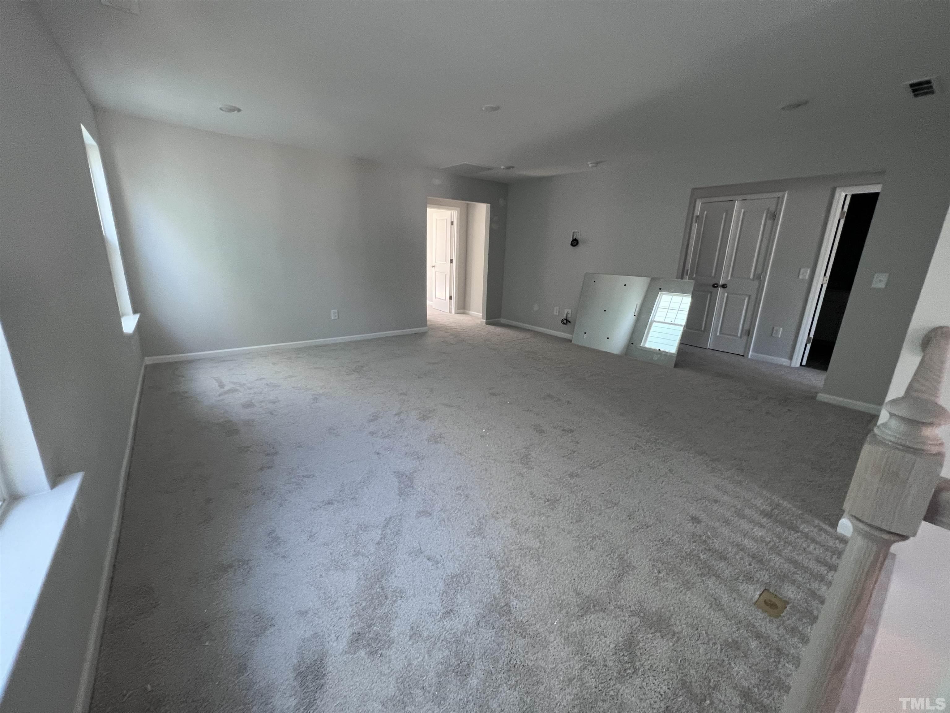 2312 Grants Pass Station Apex, NC 27502 - Photo 12 of 18 a view of an empty room with a fireplace and a window
