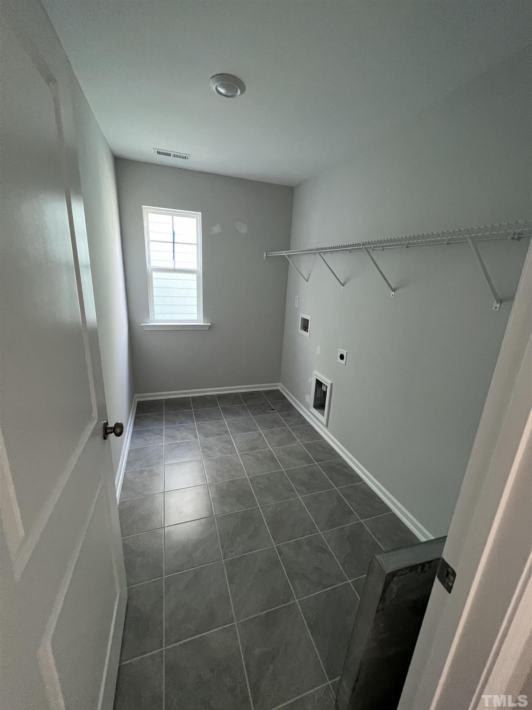 2312 Grants Pass Station Apex, NC 27502 - Photo 13 of 18 a view of an empty room with a window