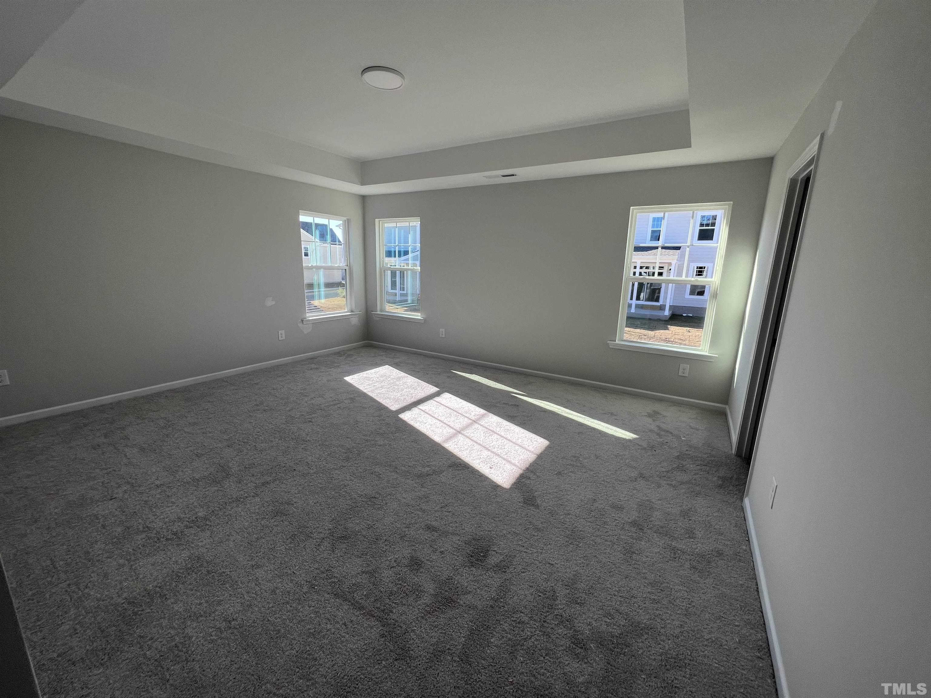2312 Grants Pass Station Apex, NC 27502 - Photo 15 of 18 an empty room with windows