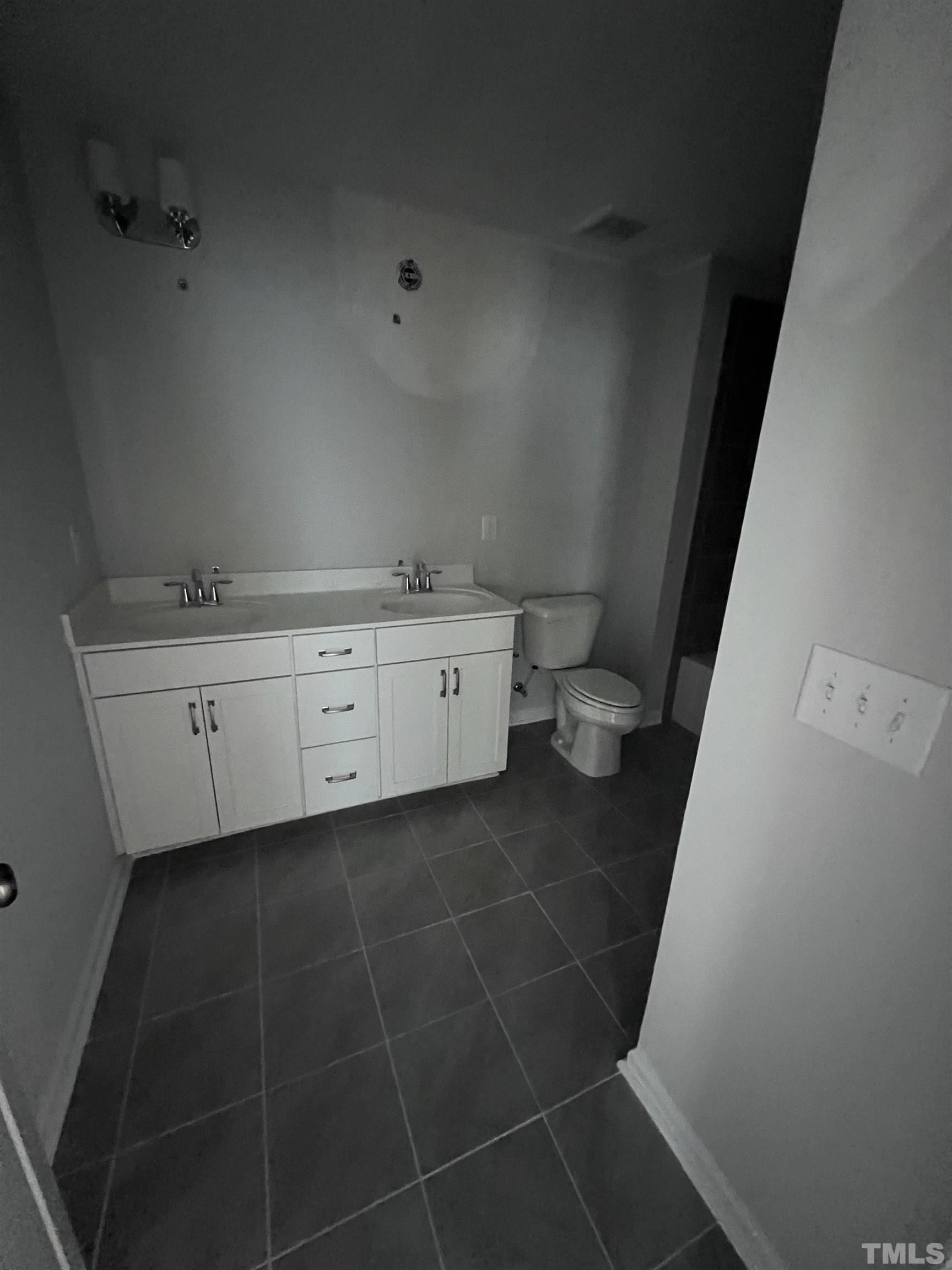 2312 Grants Pass Station Apex, NC 27502 - Photo 18 of 18 a bathroom with a sink and a toilet