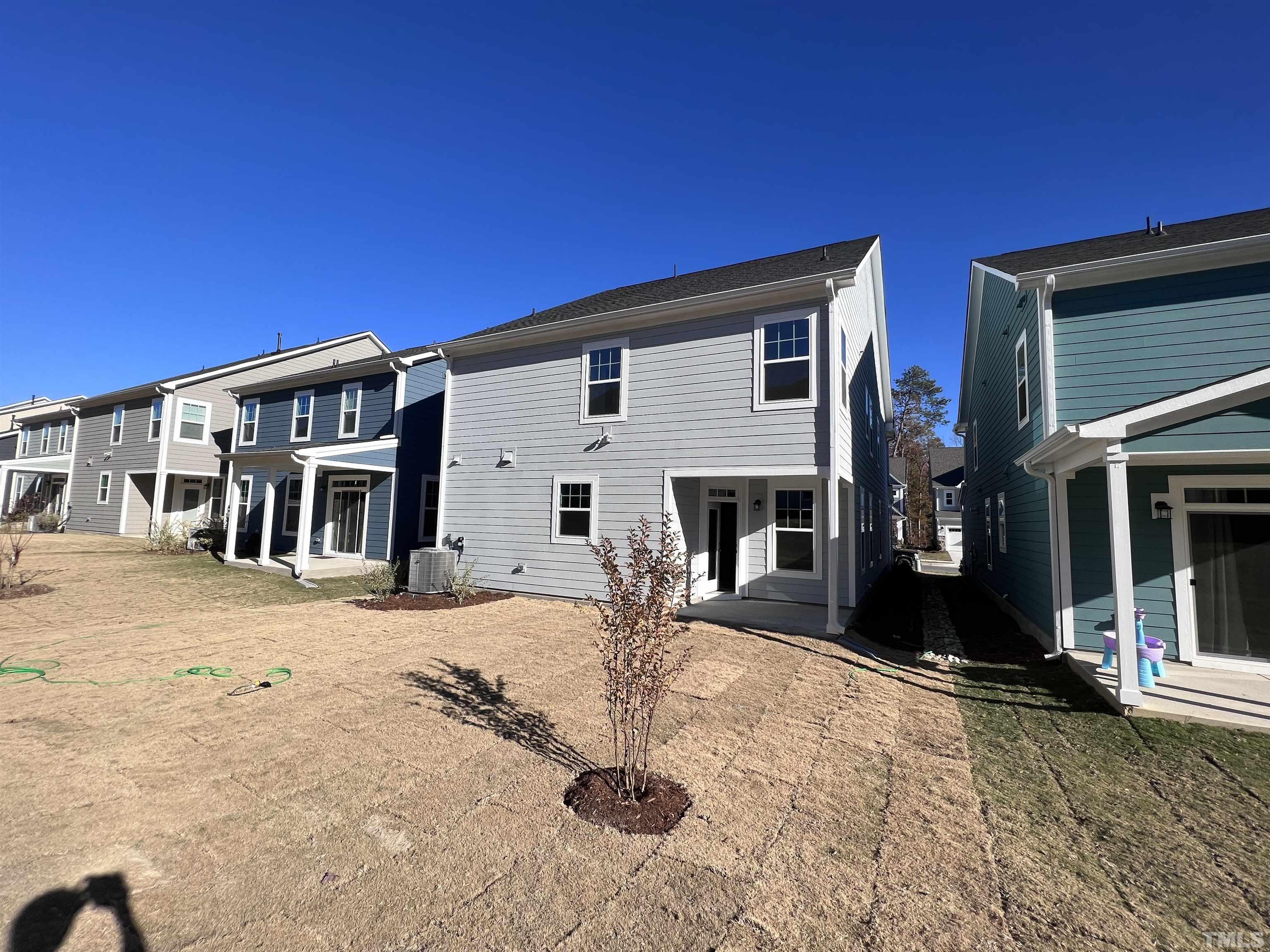 2312 Grants Pass Station Apex, NC 27502 - Photo 3 of 18 a view of a house with wooden fence
