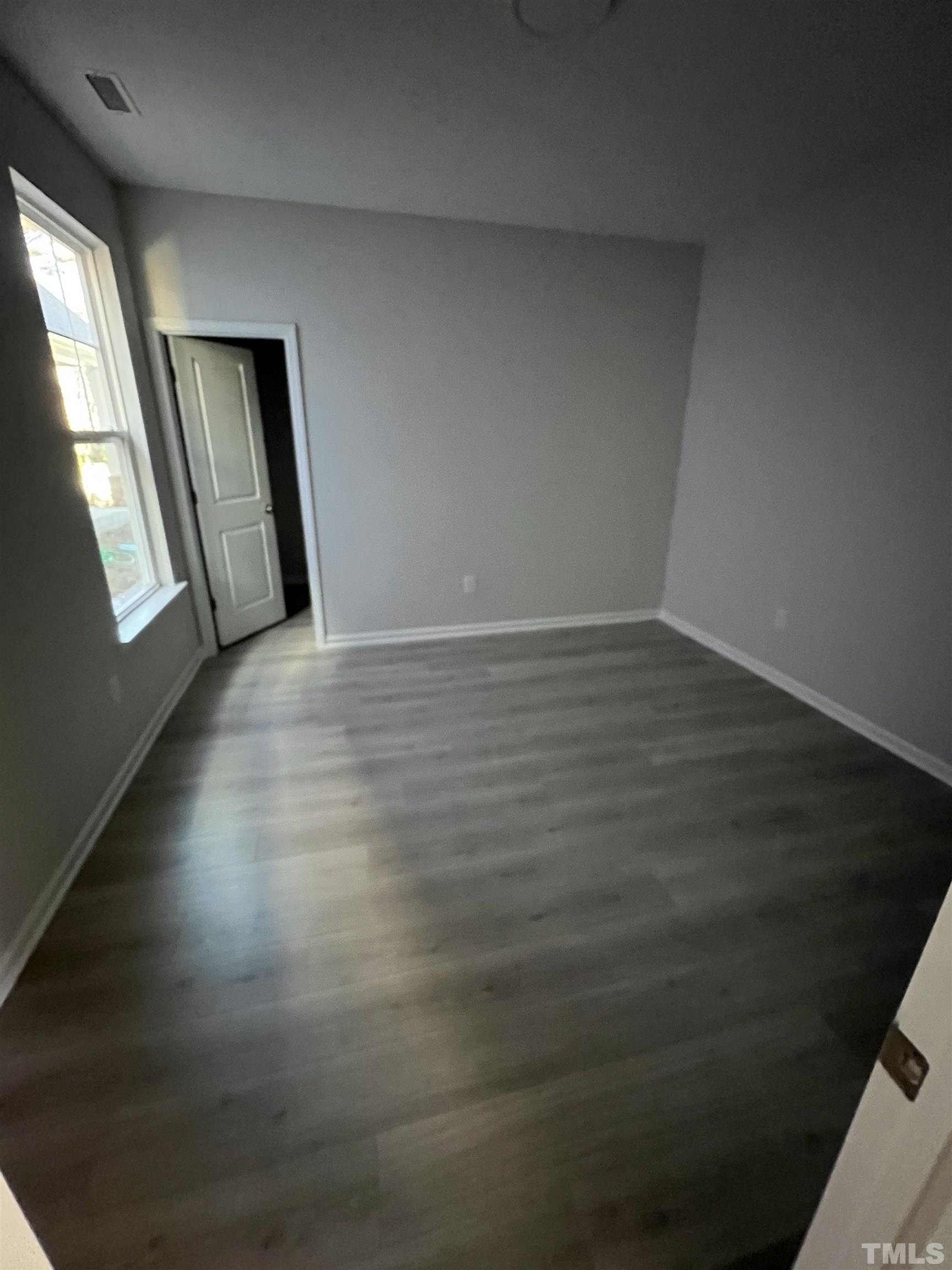 2312 Grants Pass Station Apex, NC 27502 - Photo 9 of 18 a view of an empty room and window