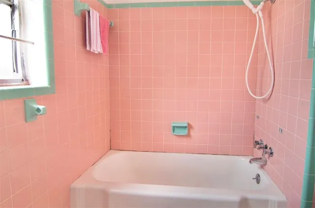 a bathroom with a white bathtub