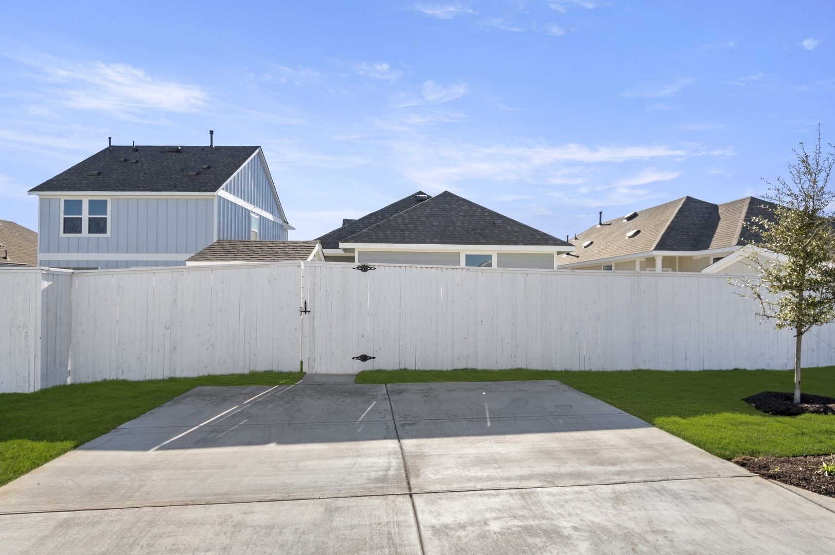 149 Daylily Drive Elgin, TX 78621 - Photo 31 of 31 a front view of a house with a yard and garage