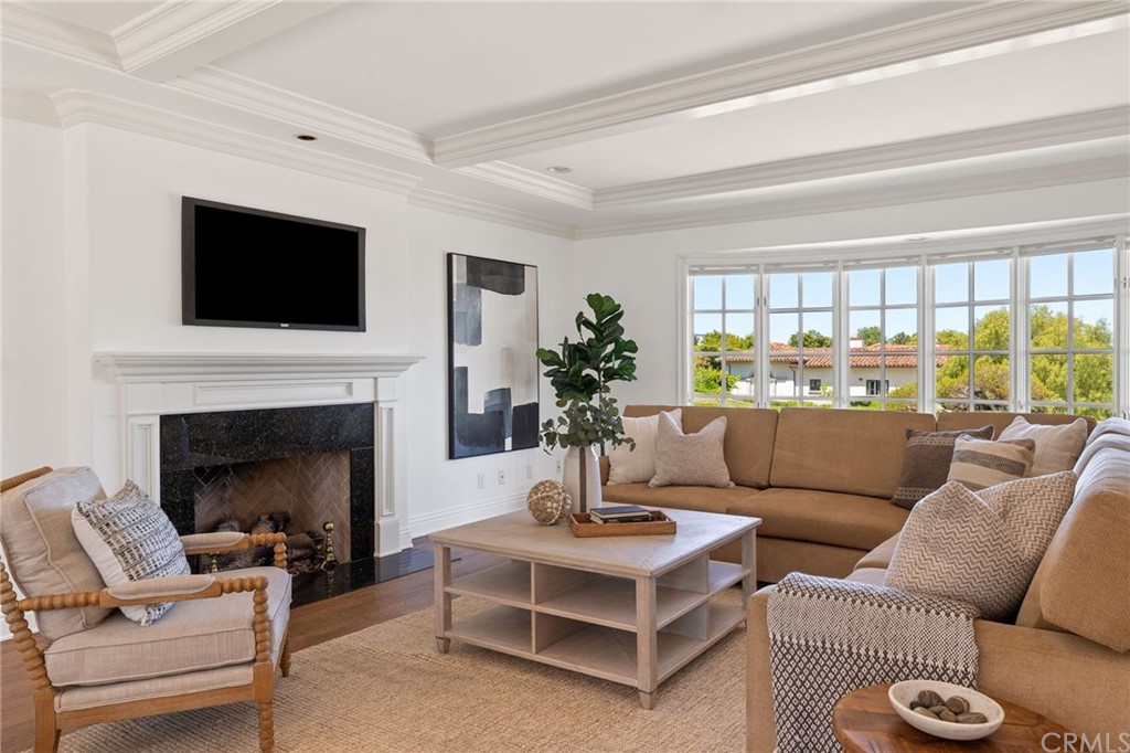 1300 Granvia Altamira Palos Verdes Estates, CA 90274 - Photo 12 of 60 a living room with furniture a fireplace and a flat screen tv