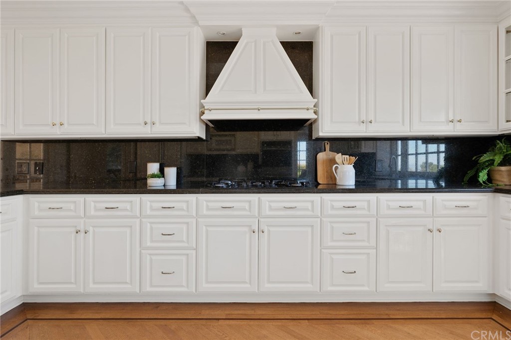 1300 Granvia Altamira Palos Verdes Estates, CA 90274 - Photo 23 of 60 a kitchen with white cabinets and white appliances