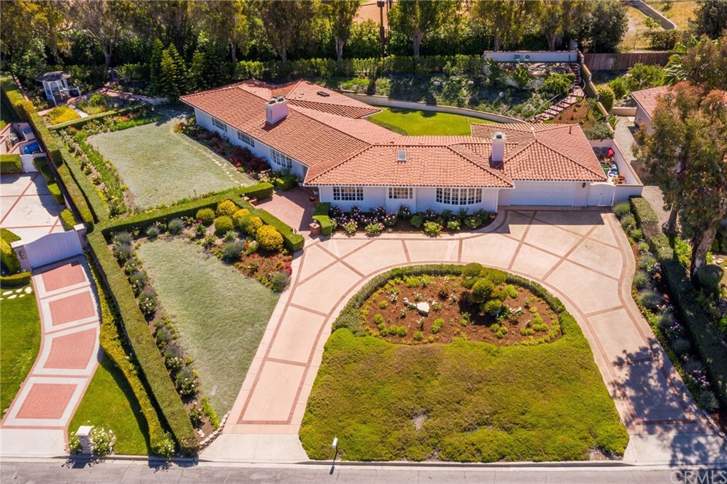 1300 Granvia Altamira Palos Verdes Estates, CA 90274 - Photo 3 of 60 an aerial view of a house with swimming pool and trees