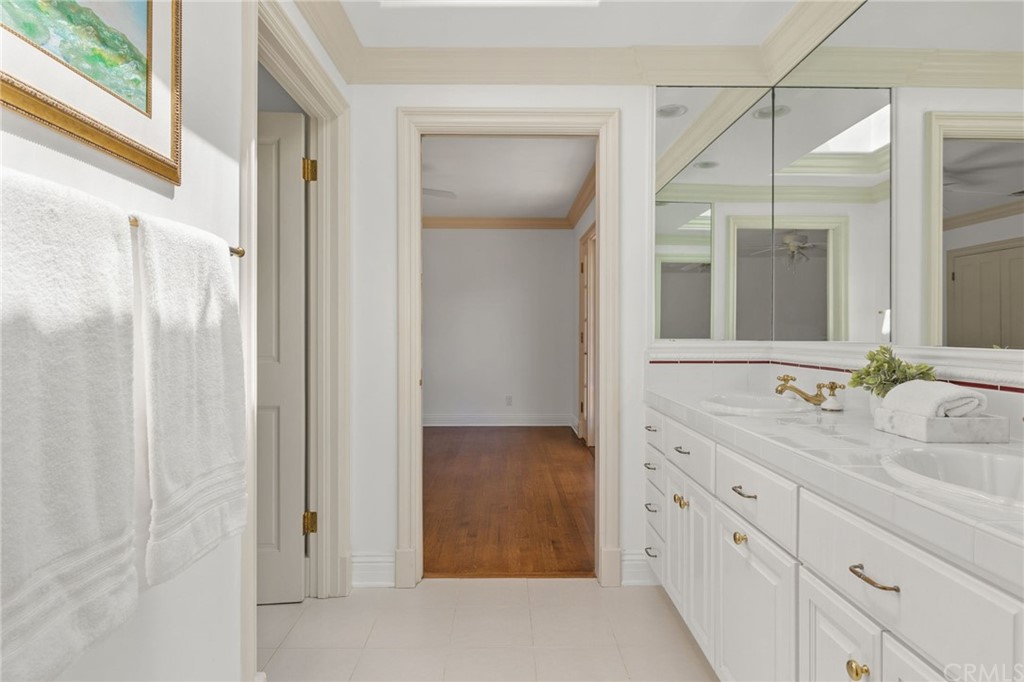 1300 Granvia Altamira Palos Verdes Estates, CA 90274 - Photo 39 of 60 a bathroom with a granite countertop sink and a mirror