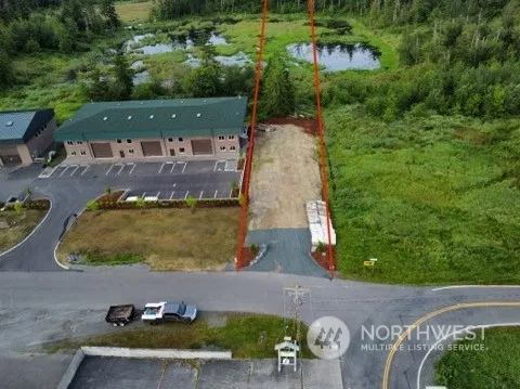 an aerial view of a house with outdoor space