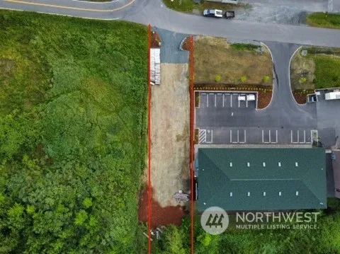 an aerial view of a house with garden space and sitting space