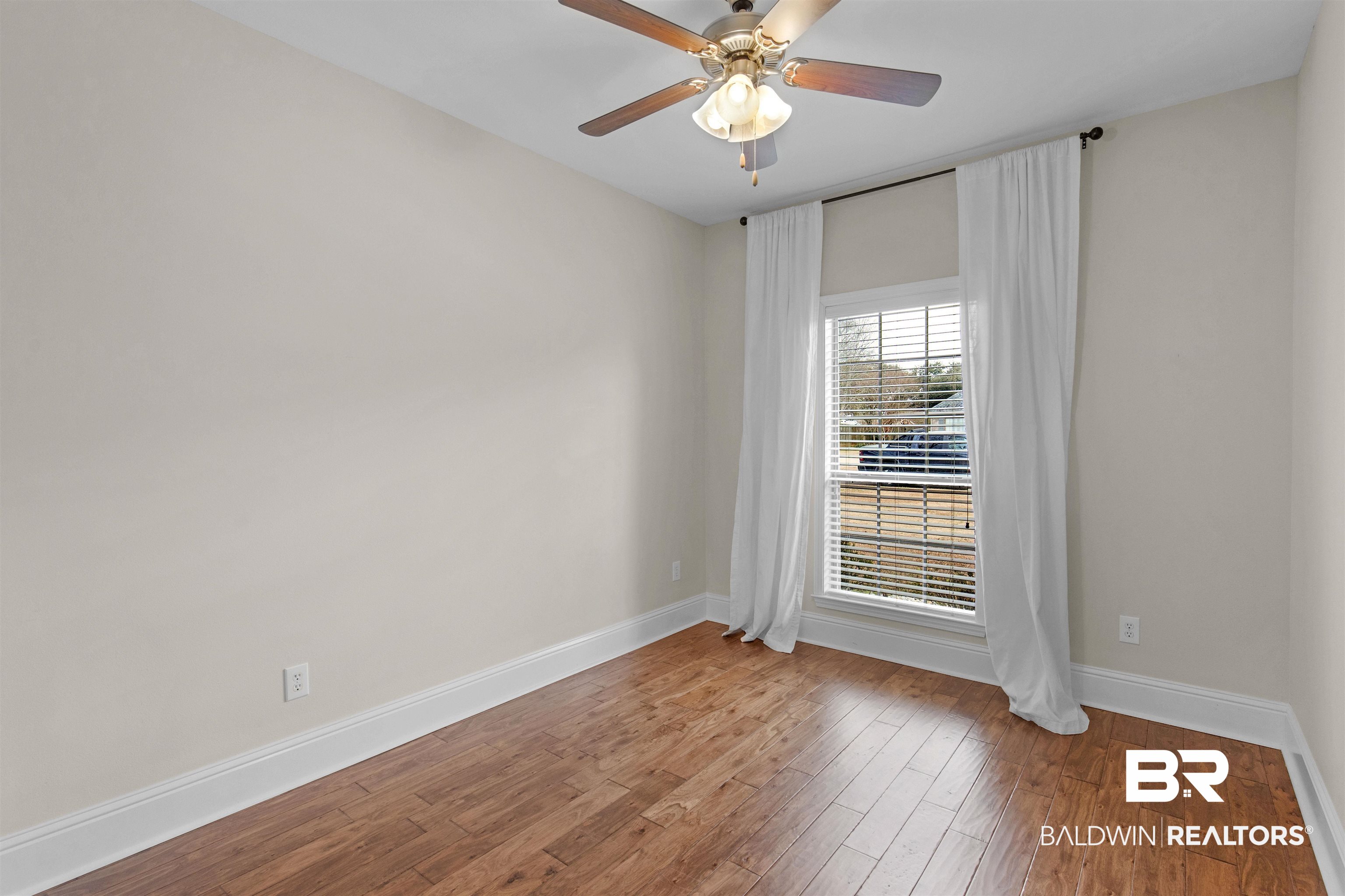 25092 Fairfax Road Daphne, AL 36526 - Photo 17 of 29 Unfurnished room featuring wood-type flooring and ceiling fan
