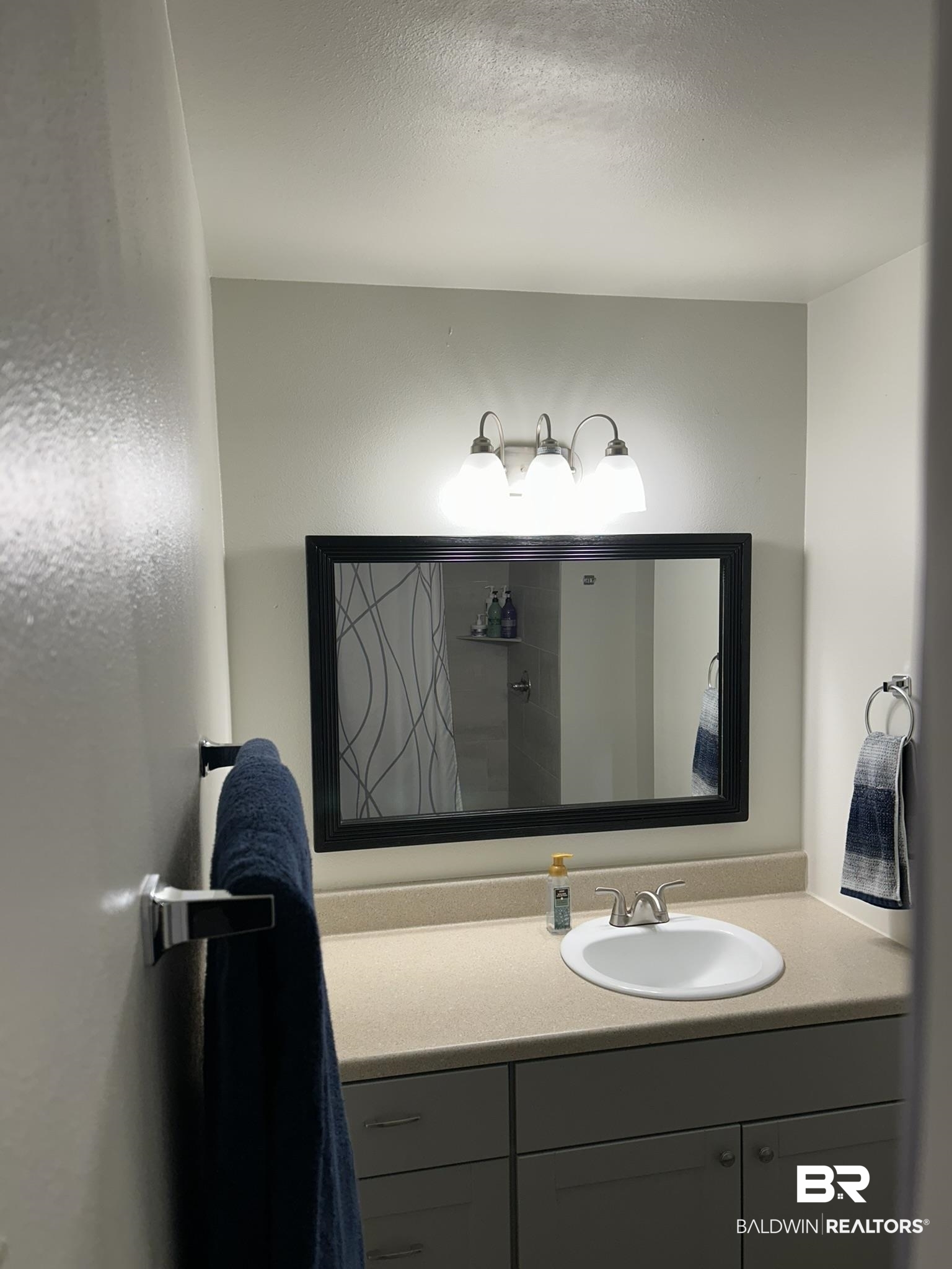 2 Canterberry Circle Foley, AL 36535 - Photo 12 of 24 Bathroom featuring vanity and a textured ceiling