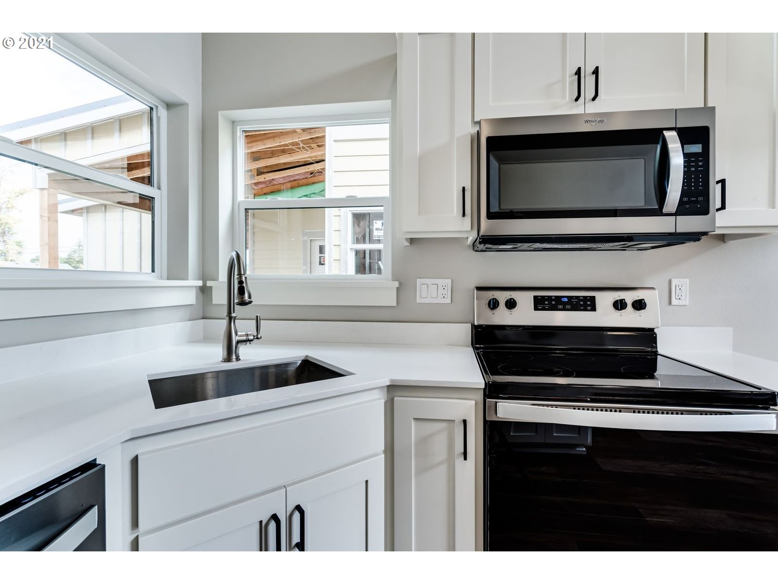 324 19th Springfield, OR 97477 - Photo 8 of 18 a kitchen with a stove and a microwave