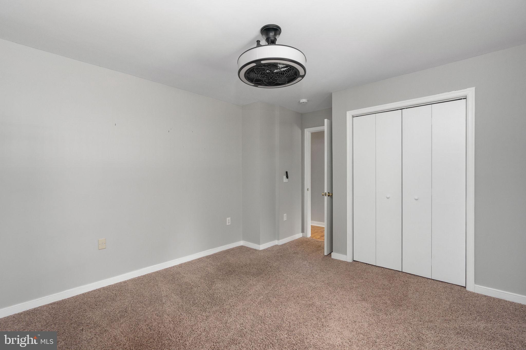 8009 Burrell Road Fredericksburg, VA 22407 - Photo 23 of 66 Spacious room with modern ceiling fan.