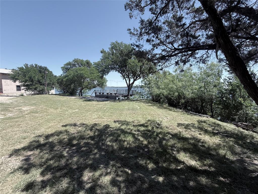 3801 Harbor View Strawn, TX 76429 - Photo 2 of 15 a view of a field with trees in the background