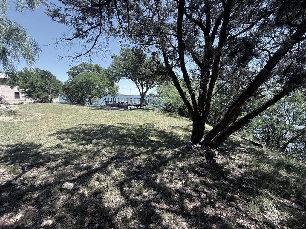 3801 Harbor View Strawn, TX 76429 - Photo 3 of 15 a big yard with lots of green space