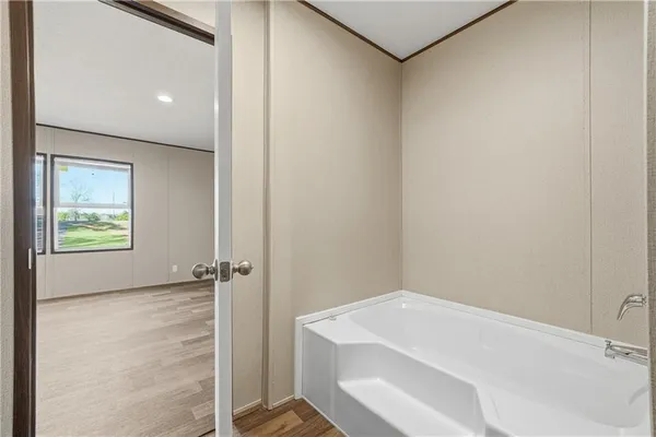 a bathroom with a bathtub and shower