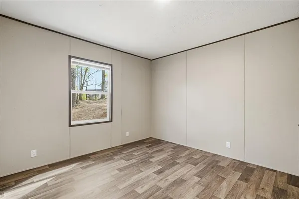 an empty room with a empty space and a window