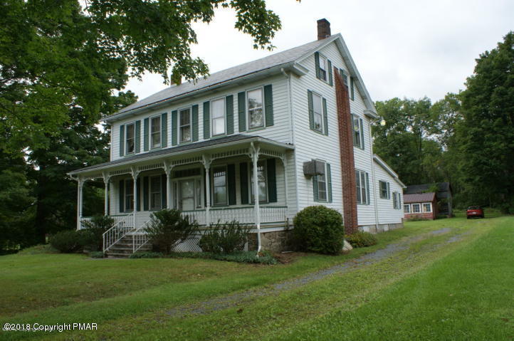 443 Bossardsville Road Stroudsburg, PA 18360 - Photo 1 of 43 a view of a yard in front of a house with plants and large trees