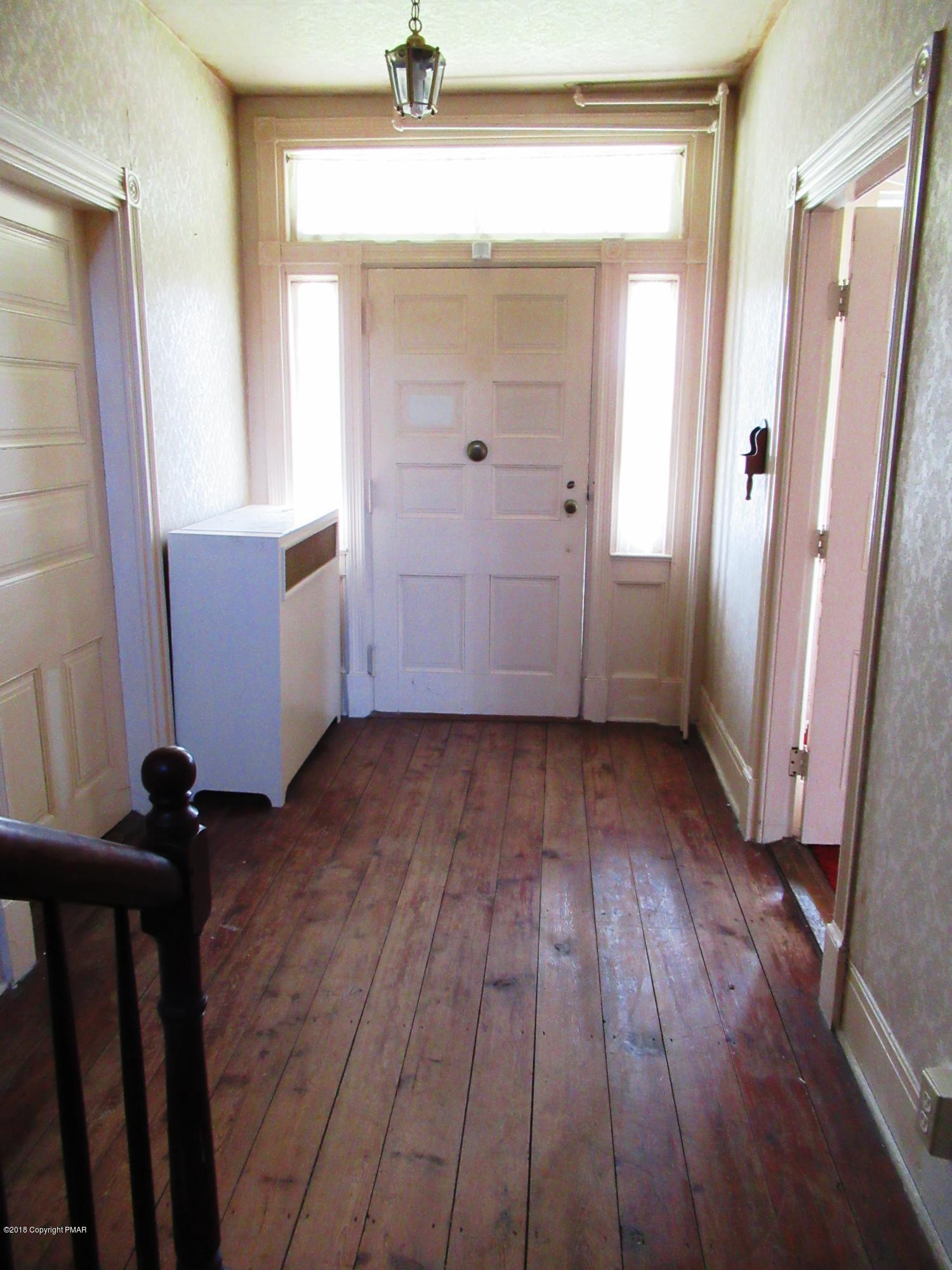 443 Bossardsville Road Stroudsburg, PA 18360 - Photo 4 of 43 wooden floor in an empty room and a mirror